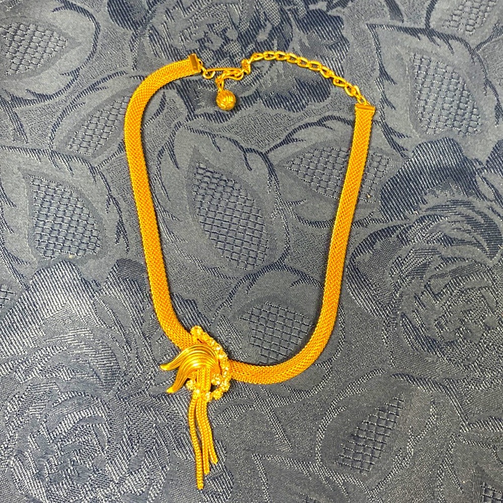 Gold toned choker necklace. Mesh design
